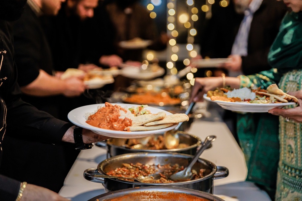 Indian Buffet featuring an extensive selection of curries, rice dishes, breads, and appetizers arranged for serving