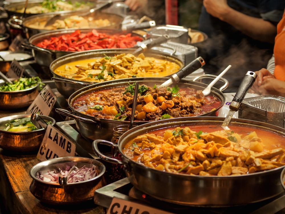 Indian Lunch Buffet featuring a selection of curries, rice dishes, breads, and accompaniments arranged for serving