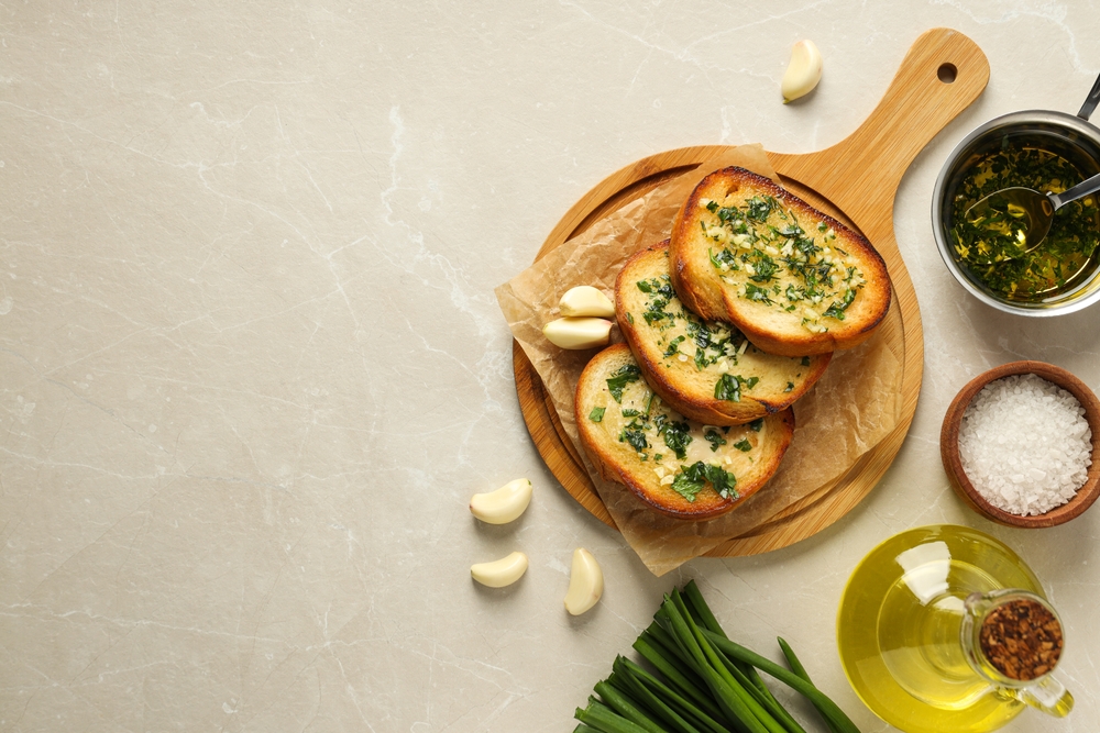 Garlic Bread presented with a crisp exterior, soft interior, and a savory garlic butter coating throughout