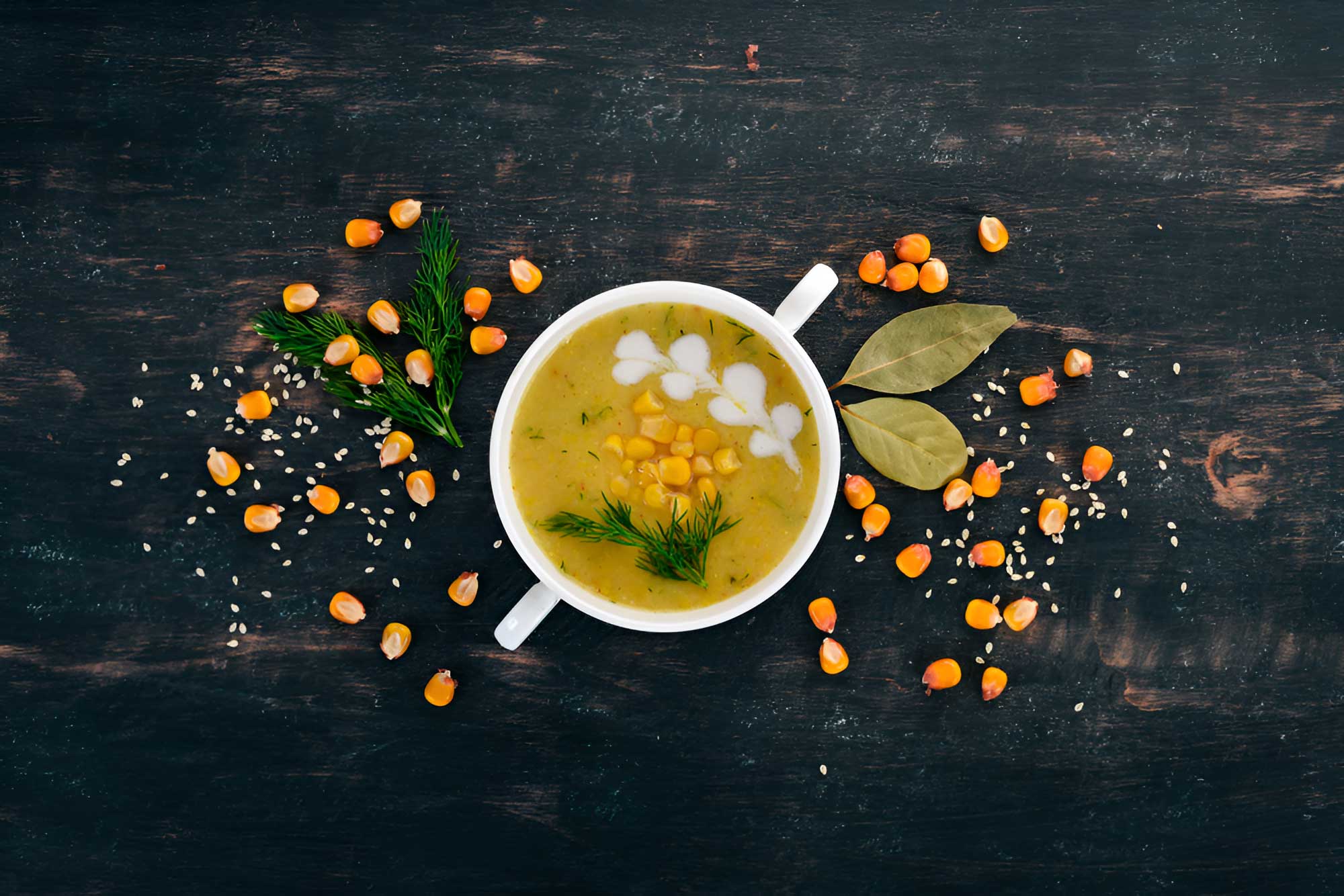 Sweet Corn Soup prepared with corn kernels, vegetables, and a smooth broth, served in a warm presentation