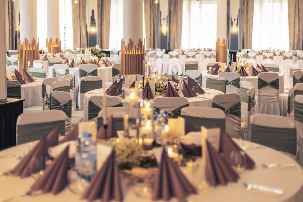 Elegant party hall with spacious seating, stylish décor, ambient lighting, and a welcoming event atmosphere.