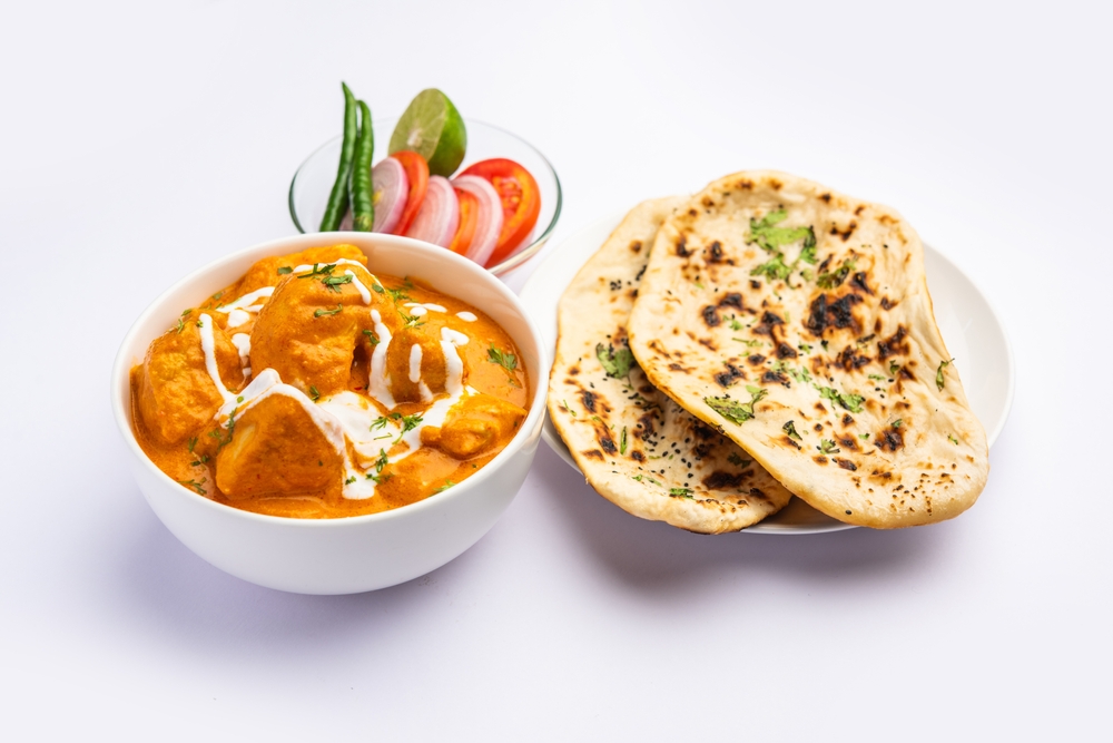 Butter Chicken and Butter Naan served with creamy tomato gravy, tender chicken, and freshly baked naan bread